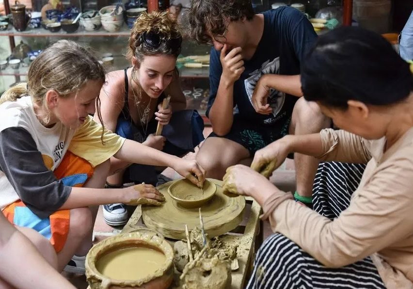 International tourists experience pottery making at Thanh Ha Pottery Village